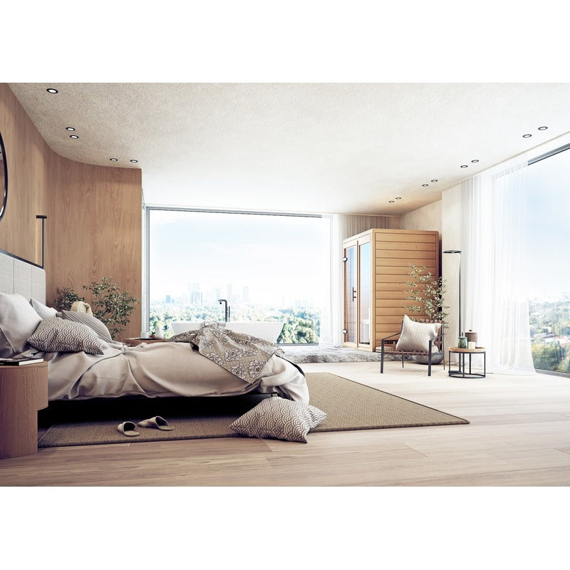 FinA Wellness Frieda mini sauna - stylishly integrated into a modern bedroom with free-standing bathtub and panoramic window